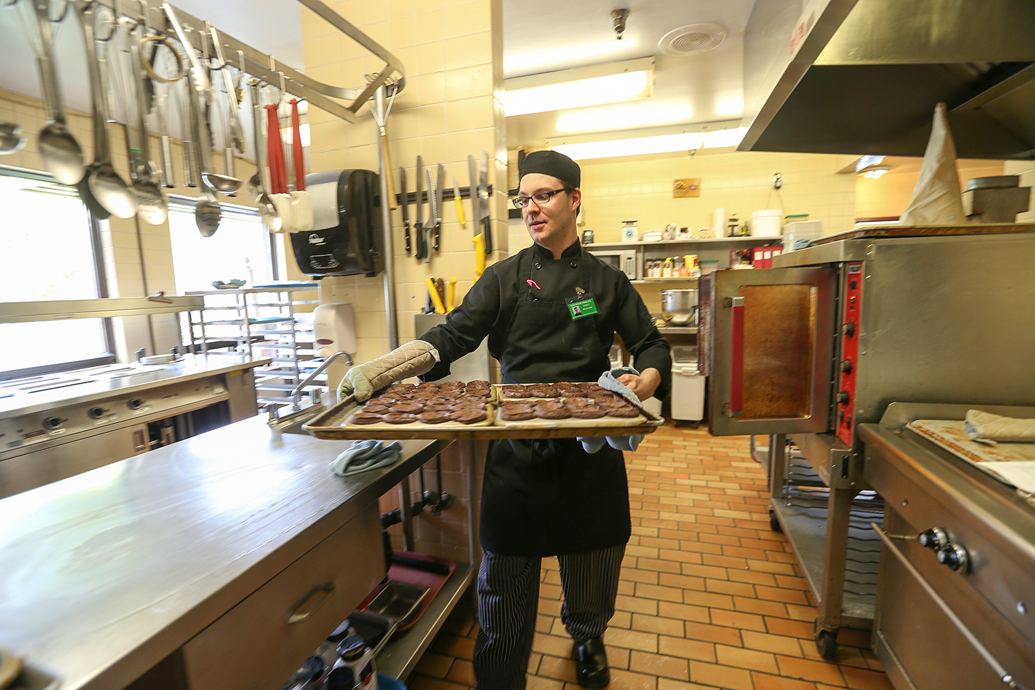 Cook working at an institutional kitchen