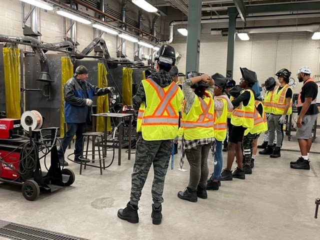 Instructor Adam Bartlett explains the welding trade to African Nova Scotian youth