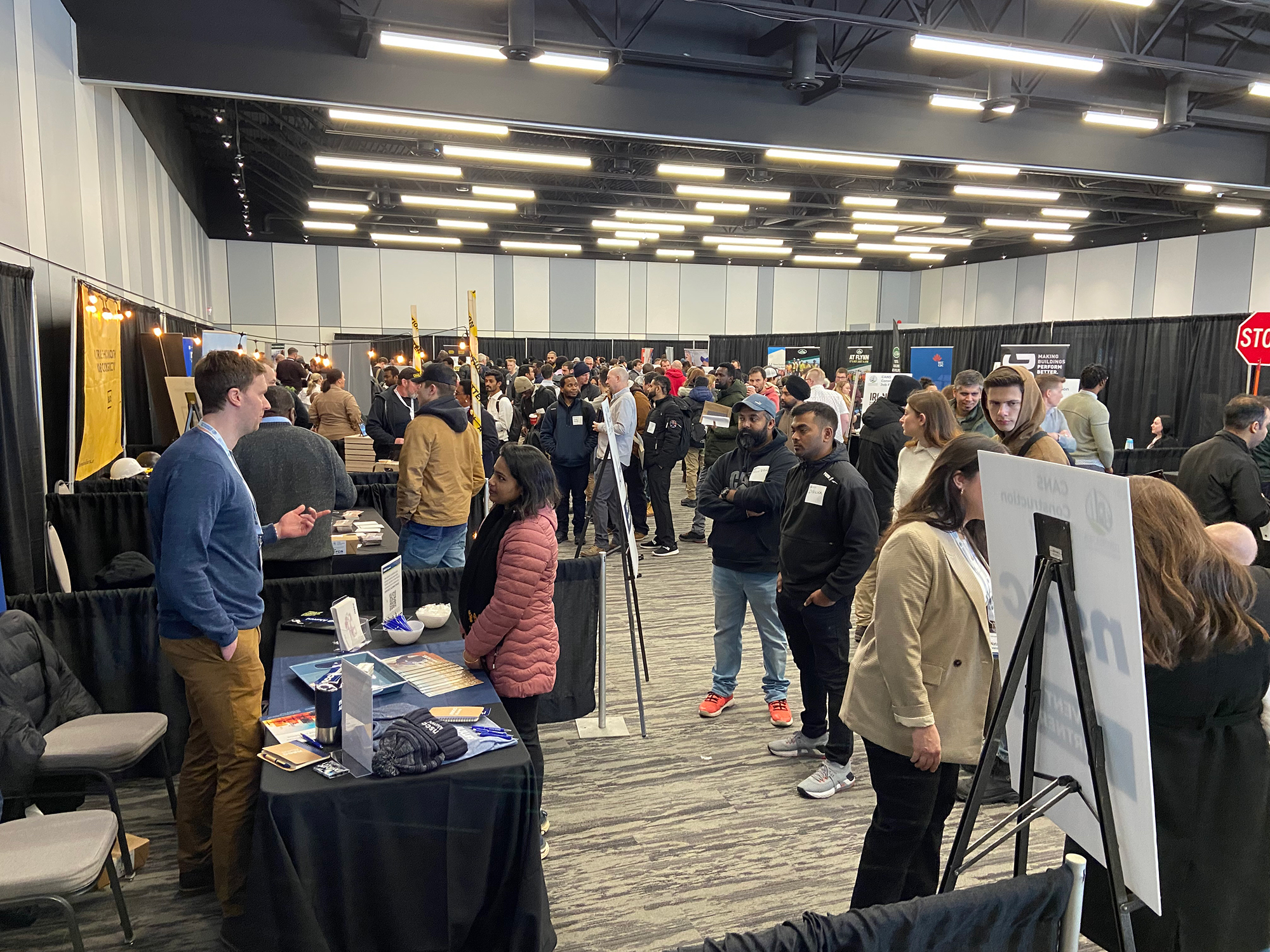 Job seekers speak to employers at the CANS Construction Job Fair