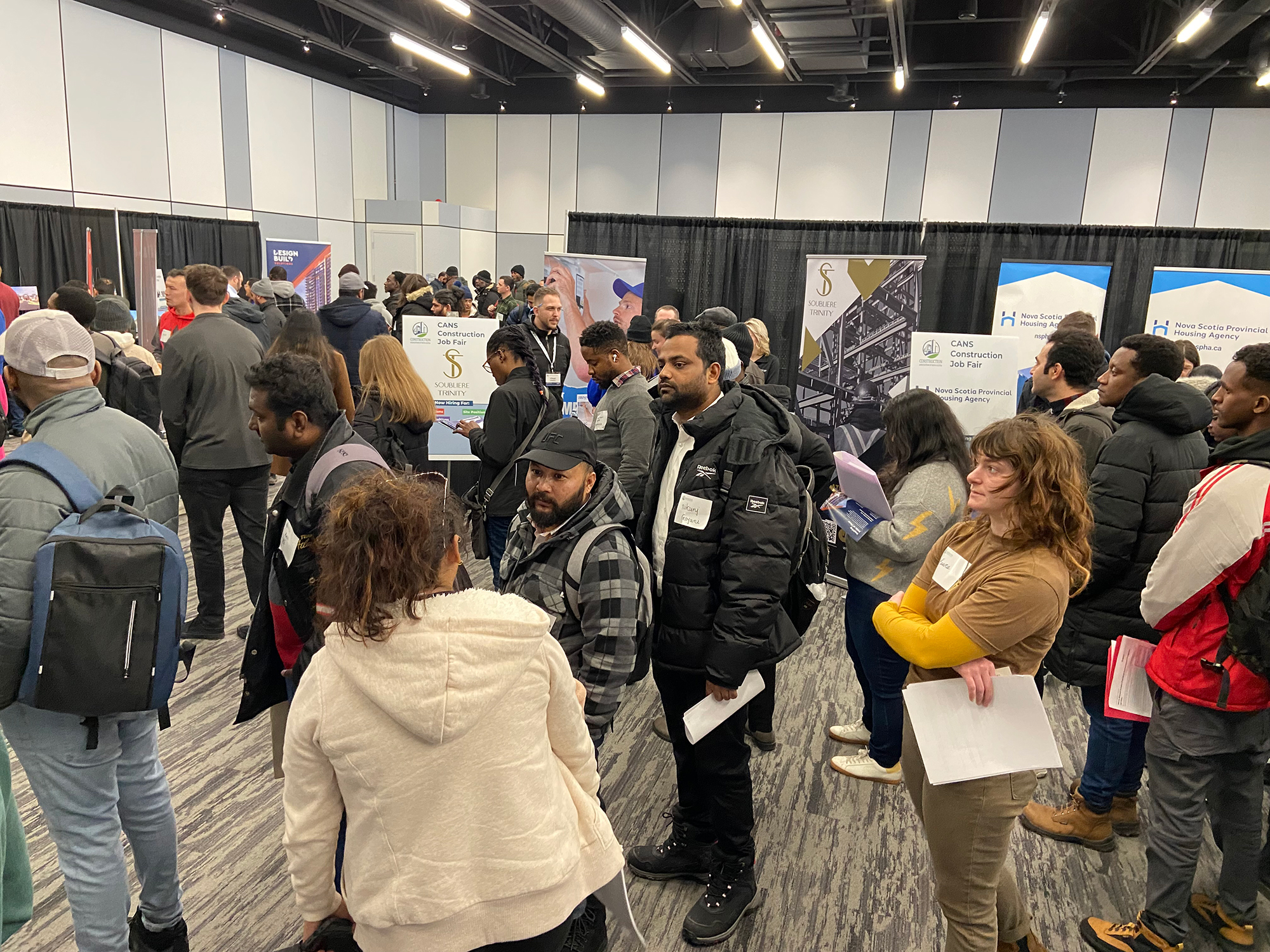 Job seekers line up at the CANS Construction Job Fair