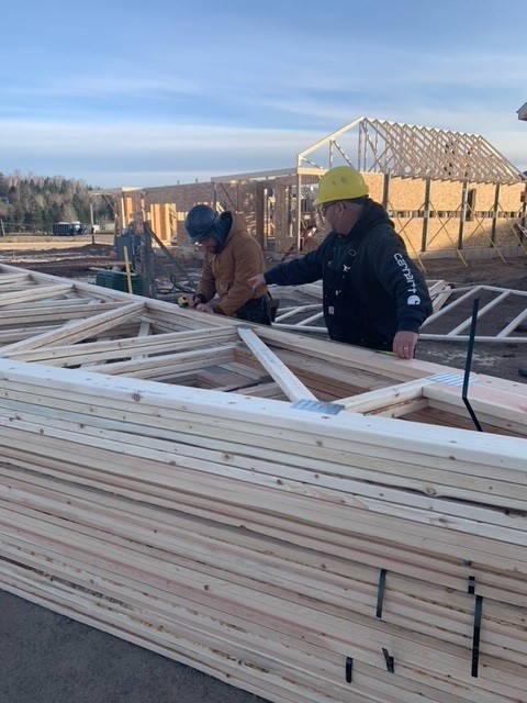 Red Seal Carpenter teaching apprentice at worksite