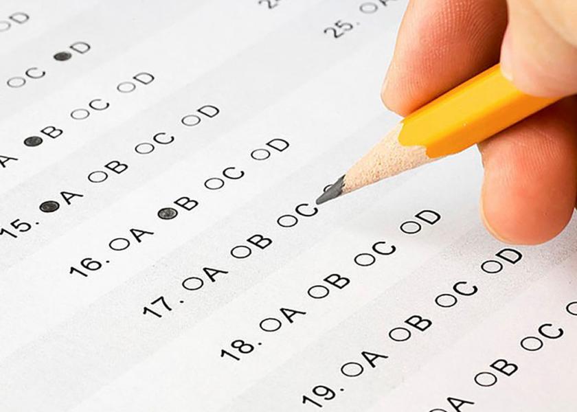 Client filling in an exam answer sheet.