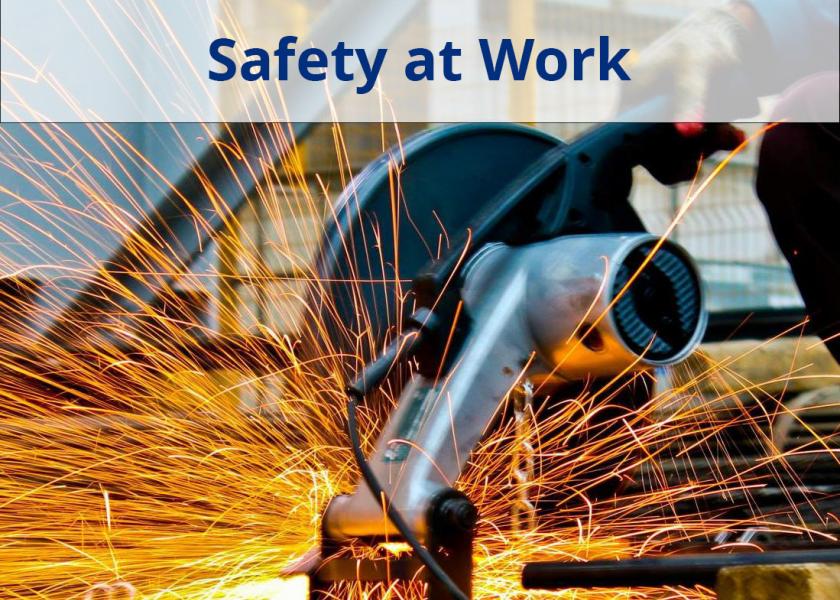 Tradesperson grinding metal with a grinder 