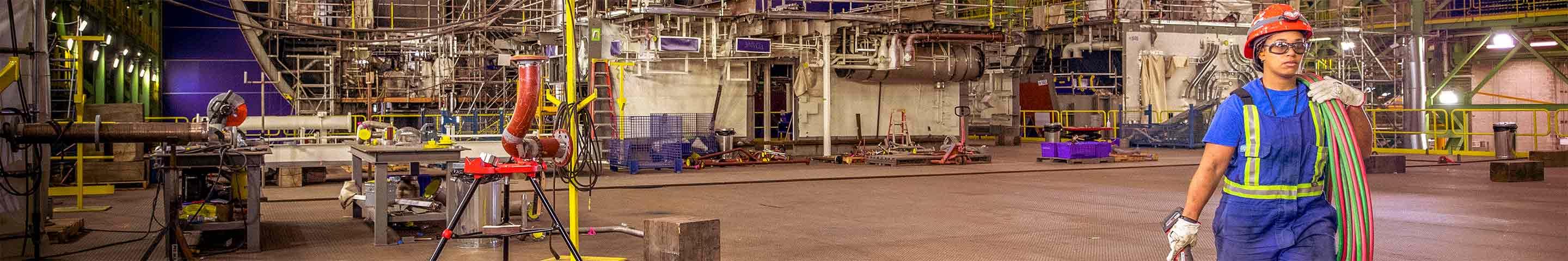 Female steamfitter working indoors