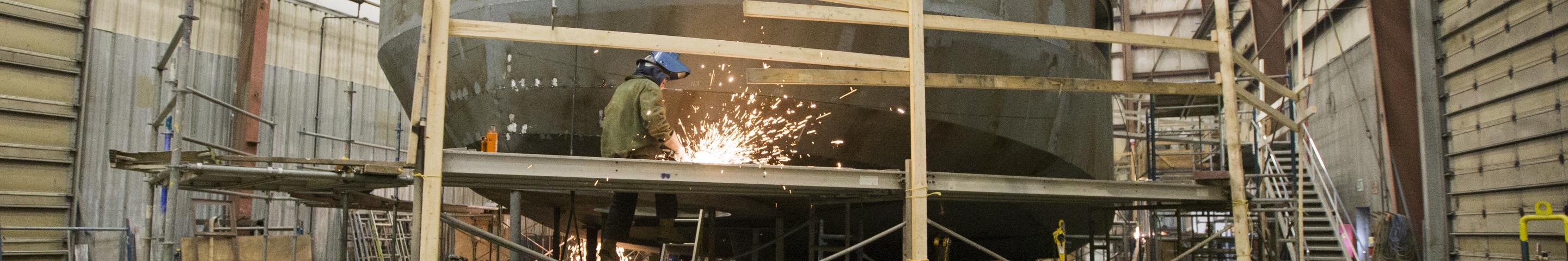 Boat builder working