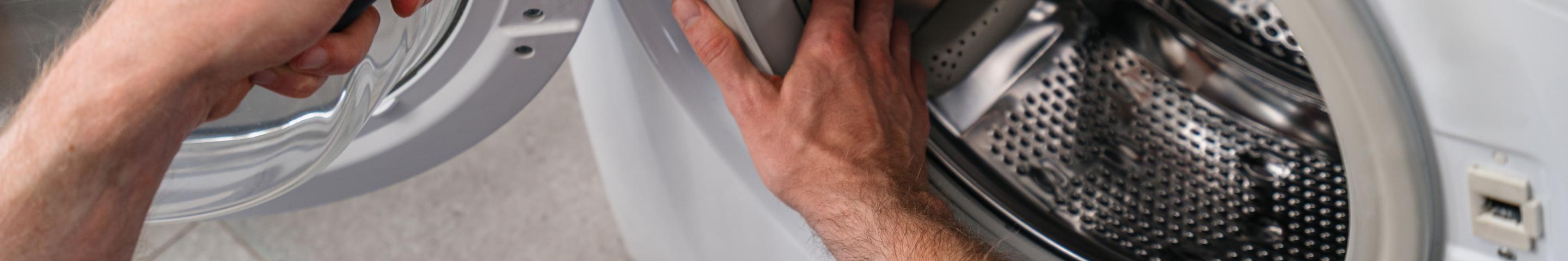 Appliance Service Technician fixing washing machine
