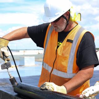 Roofer working